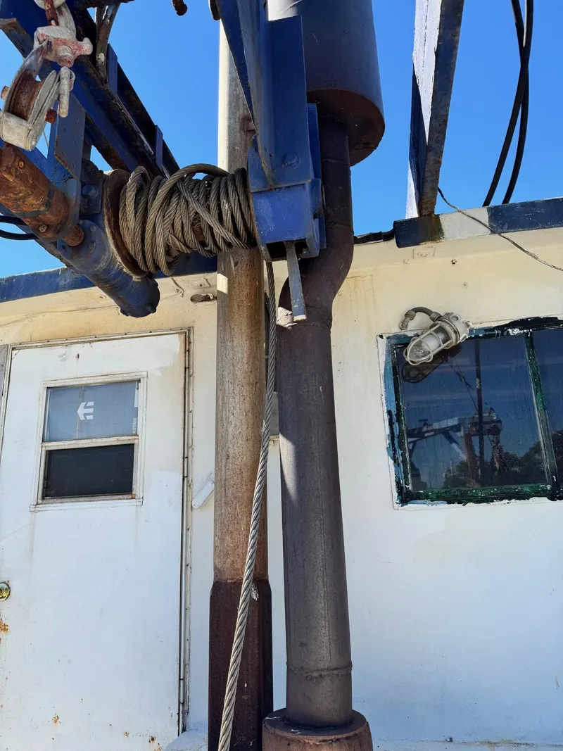 Slide: The Image of 1971 Butterfish Fishing Trawler deck with ropes and equipment. - 17