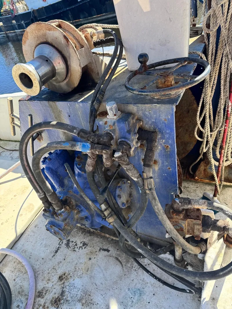 Slide: The Image of Rusty machinery on 1971 Butterfish Fishing Trawler deck with ropes and cables. - 19
