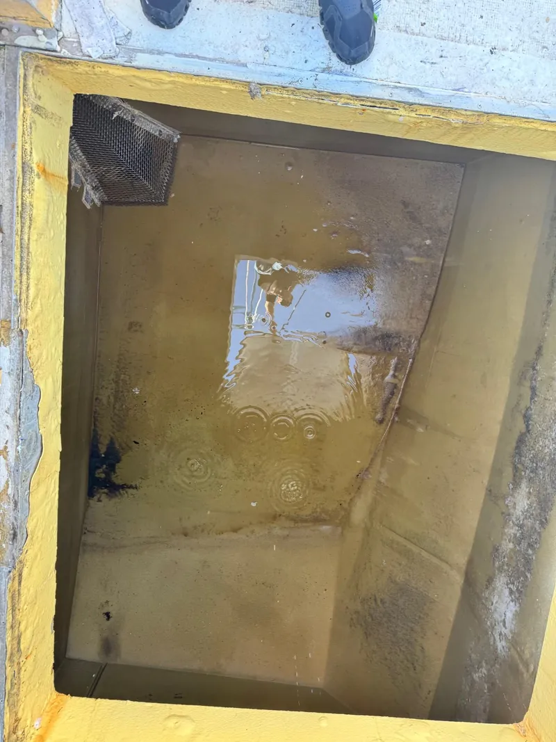 Slide: The Image of Open hatch on 1971 Butterfish Fishing Trawler deck, showing interior compartment. - 25