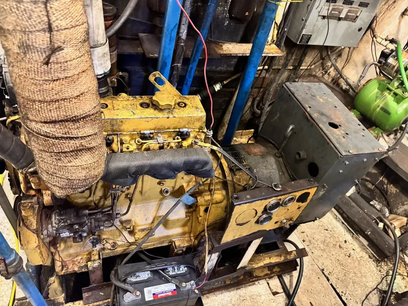 Slide: The Image of Engine room of 1971 Butterfish Fishing Trawler with visible machinery and control panel. - 6