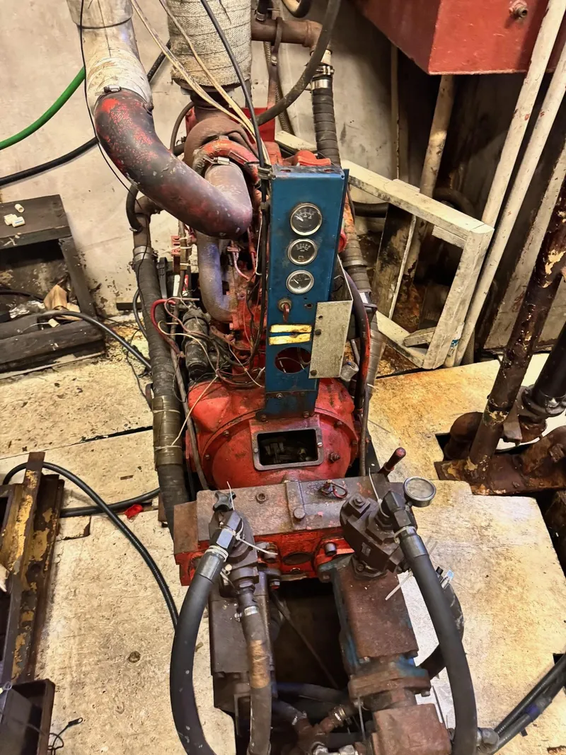 Slide: The Image of Engine room of a 1971 Butterfish Fishing Trawler, showing machinery and gauges. - 7