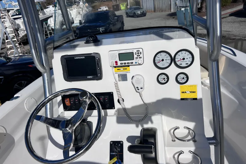 Slide: The Image of 2015 Sea Fox 199 Commander boat dashboard with steering wheel and navigation instruments. - 11