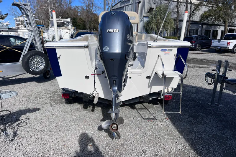 Slide: The Image of 2015 Sea Fox 199 Commander boat with Yamaha 150 outboard motor, parked on gravel. - 3