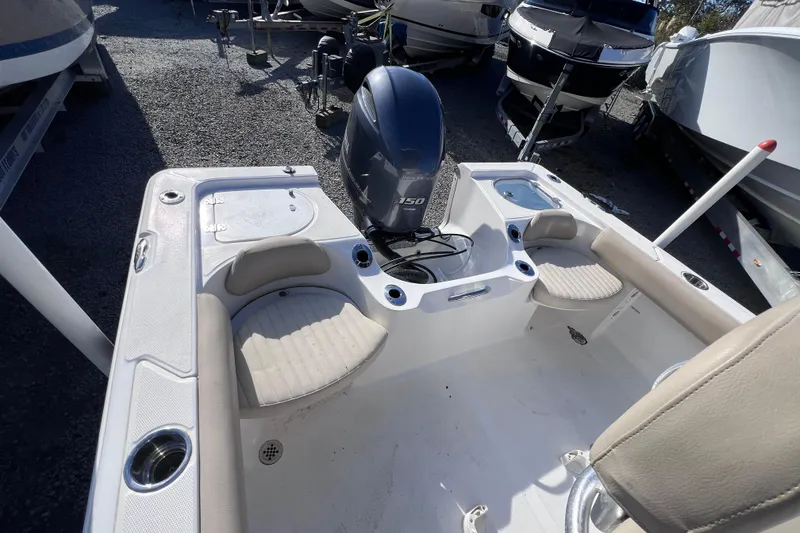 Slide: The Image of 2015 Sea Fox 199 Commander boat interior with seating and outboard motor. - 4