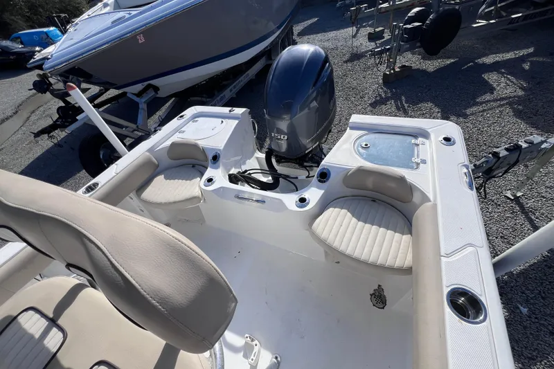 Slide: The Image of 2015 Sea Fox 199 Commander boat interior with seating and outboard motor. - 5