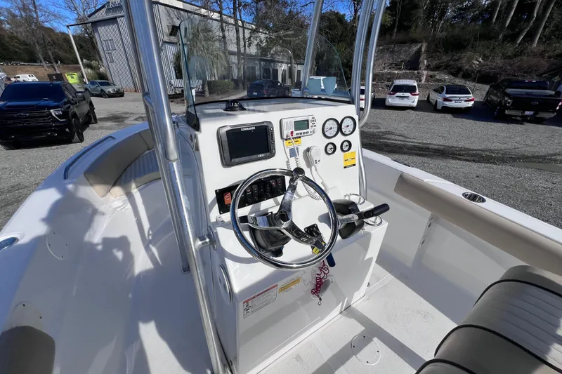 Slide: The Image of 2015 Sea Fox 199 Commander boat dashboard with steering wheel and gauges. - 6