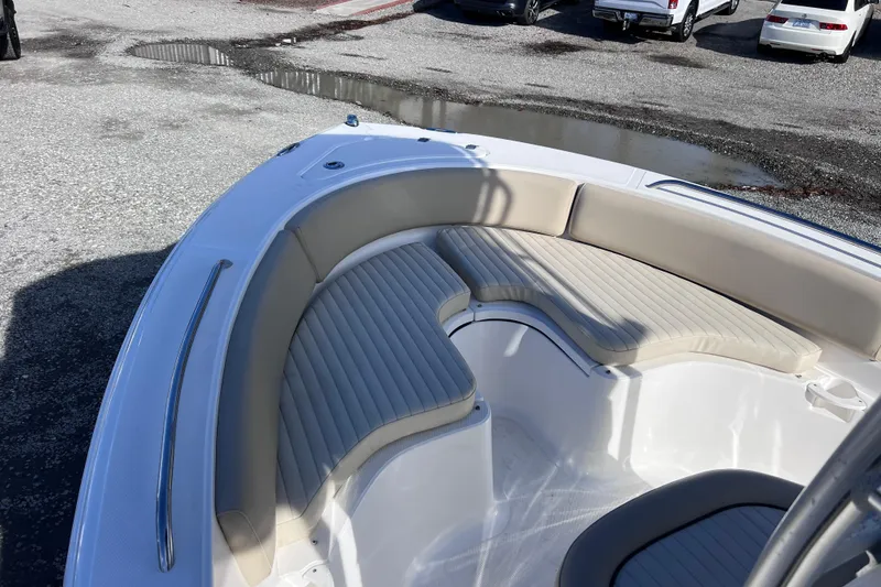 Slide: The Image of 2015 Sea Fox 199 Commander boat with beige seating, parked on gravel. - 8