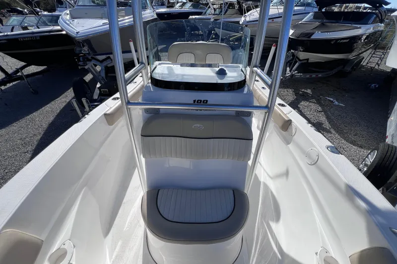 Slide: The Image of 2015 Sea Fox 199 Commander boat interior with seating and console, docked among other boats. - 9