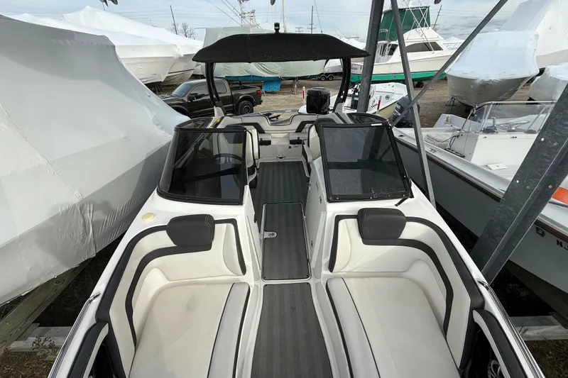 Slide: The Image of 2019 Yamaha Boats 242 Limited S interior view, featuring sleek seating and modern design. - 12
