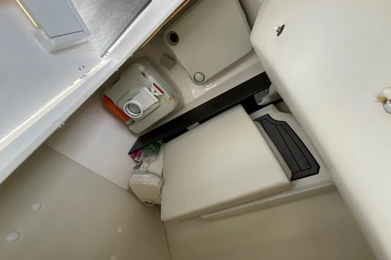 Slide: The Image of 2019 Yamaha Boats 242 Limited S interior cabin with compact amenities. - 17