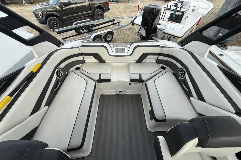 Slide: The Image of 2019 Yamaha Boats 242 Limited S interior with spacious seating and modern design. - 5
