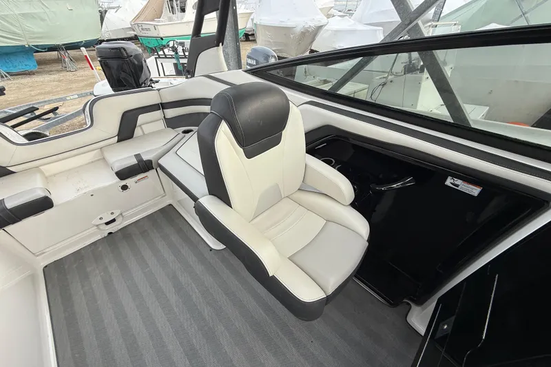 Slide: The Image of 2019 Yamaha Boats 242 Limited S interior with sleek seating and modern design. - 8