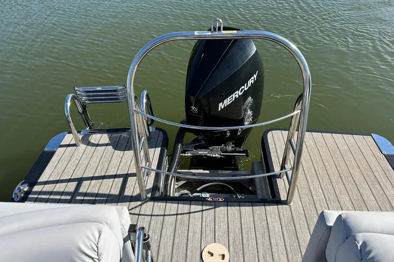 Slide: The Image of 2020 Harris FloteBote Solstice 230 with Mercury outboard motor on water. - 21