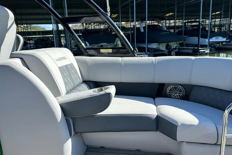Slide: The Image of 2020 Harris FloteBote Solstice 230 interior with plush seating and cup holder. - 28