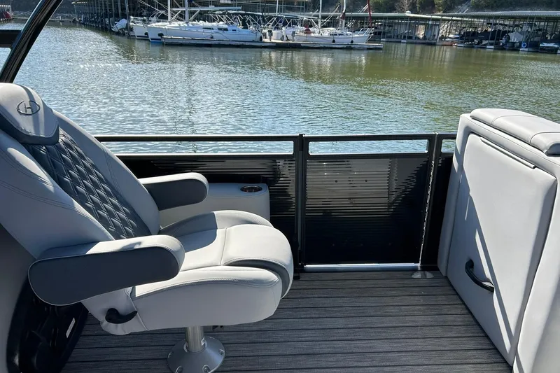 Slide: The Image of 2020 Harris FloteBote Solstice 230 interior with luxurious seating, overlooking marina. - 29