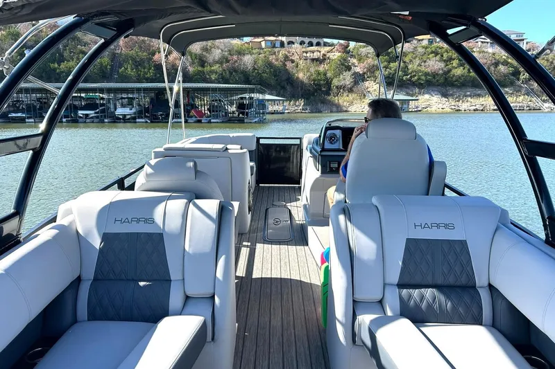 Slide: The Image of 2020 Harris FloteBote Solstice 230 pontoon boat on a scenic lake. - 3