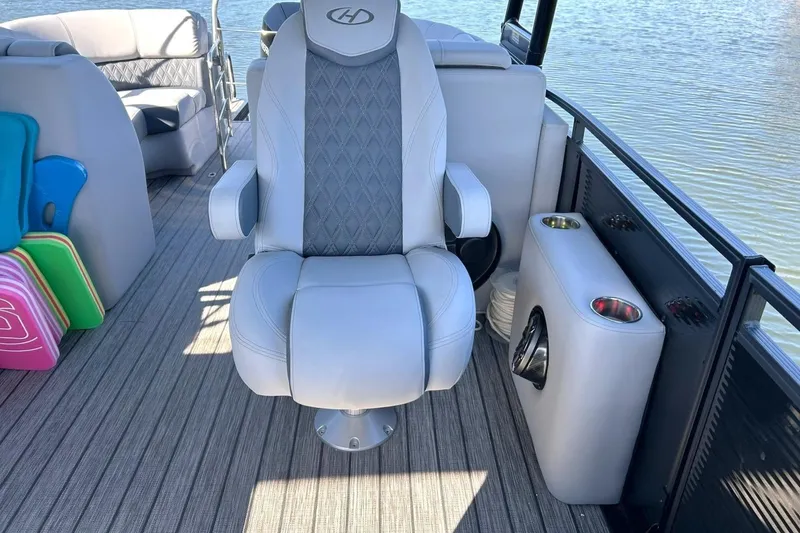 Slide: The Image of 2020 Harris FloteBote Solstice 230 interior with luxury seating and cup holders. - 30