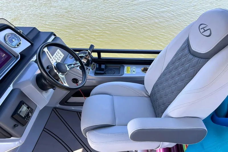 Slide: The Image of Captain's seat and helm of 2020 Harris FloteBote Solstice 230 pontoon boat. - 32