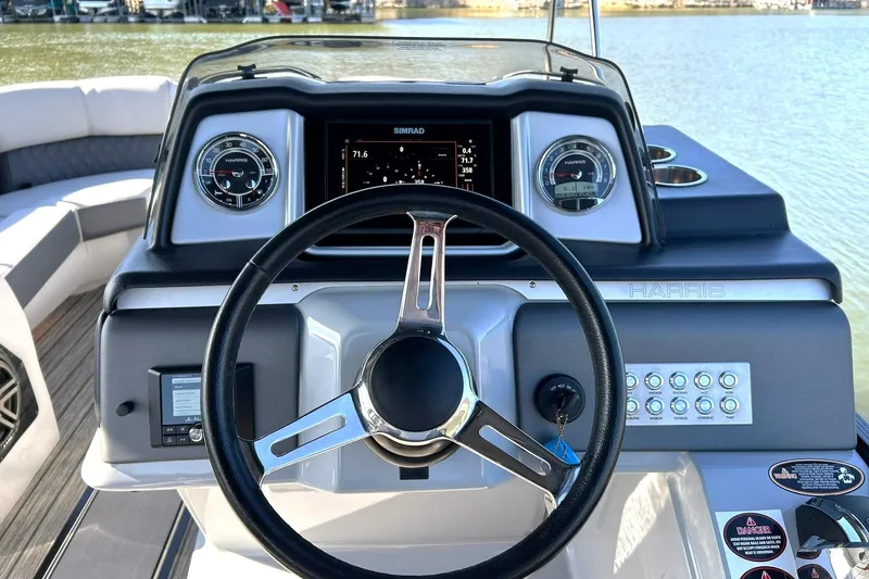 Slide: The Image of 2020 Harris FloteBote Solstice 230 dashboard with steering wheel and control panel. - 34
