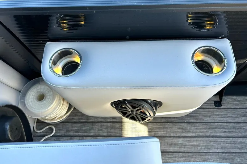 Slide: The Image of 2020 Harris FloteBote Solstice 230 boat interior with cup holders and speaker. - 45
