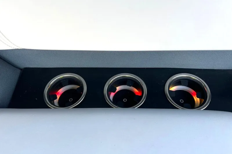 Slide: The Image of Three cup holders on a 2020 Harris FloteBote Solstice 230 boat interior. - 46