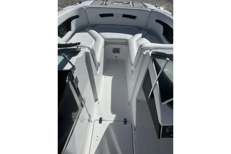 Slide: The Image of 2023 Four Winns HD3 boat interior with white seating and sleek design. - 16