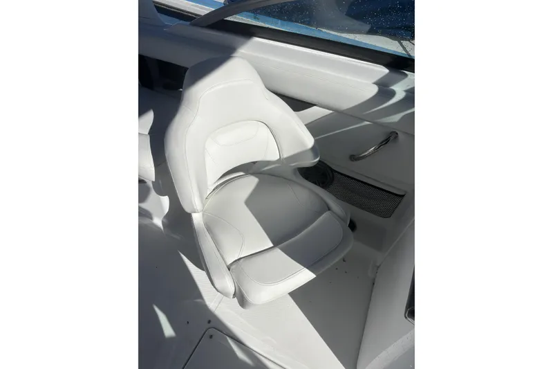 Slide: The Image of 2023 Four Winns HD3 boat interior with white seating and sleek design. - 17