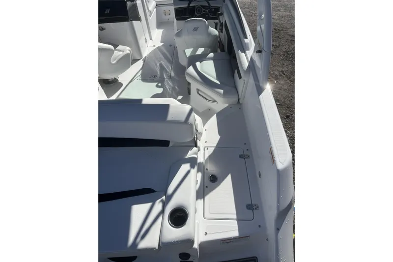 Slide: The Image of 2023 Four Winns HD3 boat interior with seating and storage compartments. - 33