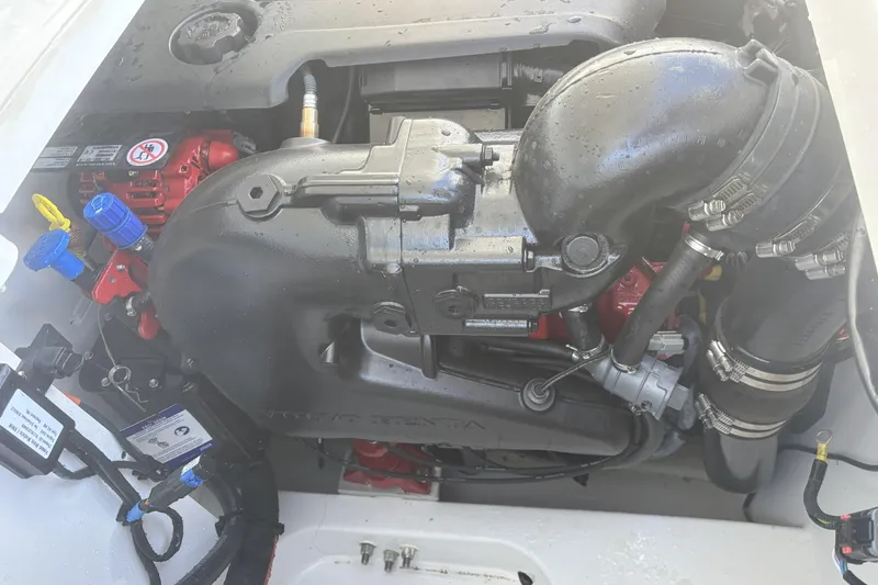 Slide: The Image of 2023 Four Winns HD3 engine compartment with visible components and connections. - 36