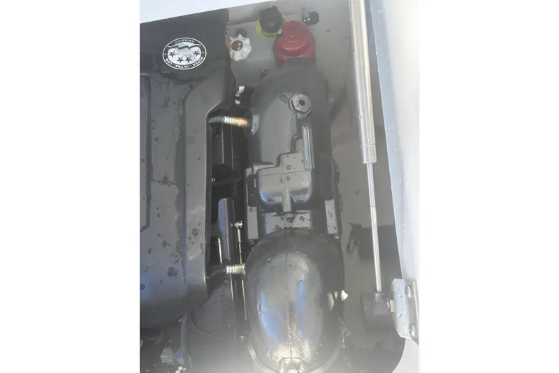 Slide: The Image of 2023 Four Winns HD3 engine compartment with visible components and hydraulic support. - 38