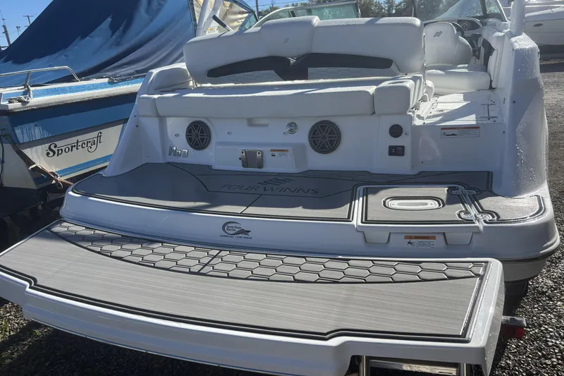 Slide: The Image of 2023 Four Winns HD3 boat with spacious deck and modern design features. - 5