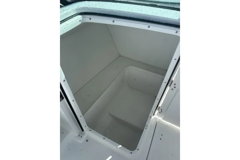 Slide: The Image of 2023 Four Winns HD3 boat storage compartment, open and empty. - 8