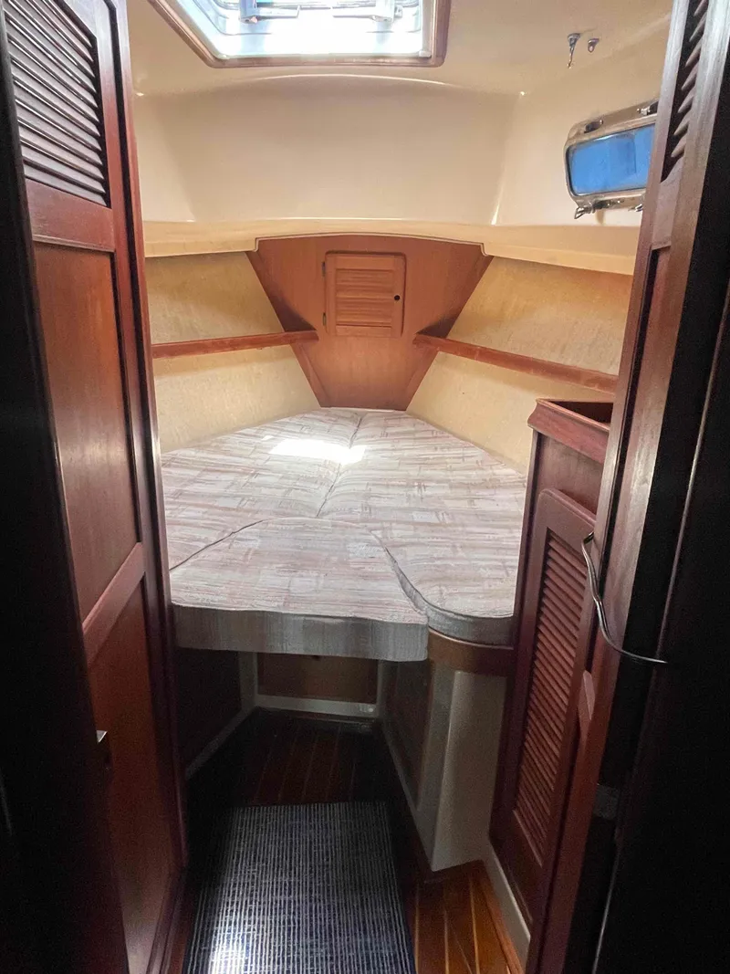 Slide: The Image of Interior of 1990 Island Packet 35 Cutter with storage compartments and seating. - 19