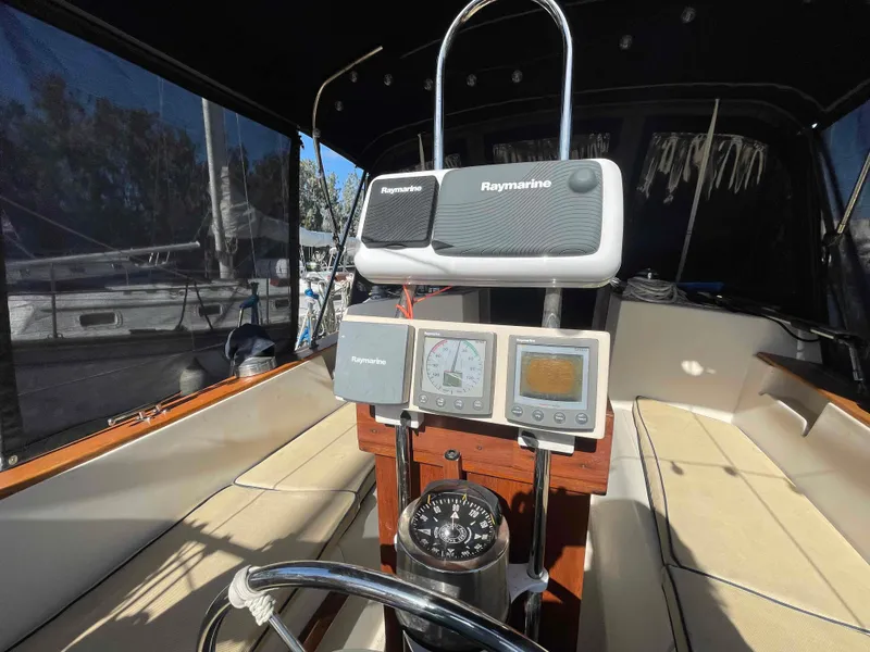 Slide: The Image of Engine components of a 1990 Island Packet 35 Cutter sailboat, showing hoses and metal fittings. - 36