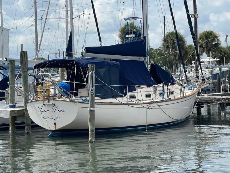 Slide: The Image of 1990 Island Packet 35 Cutter sailboat docked in marina. - 4