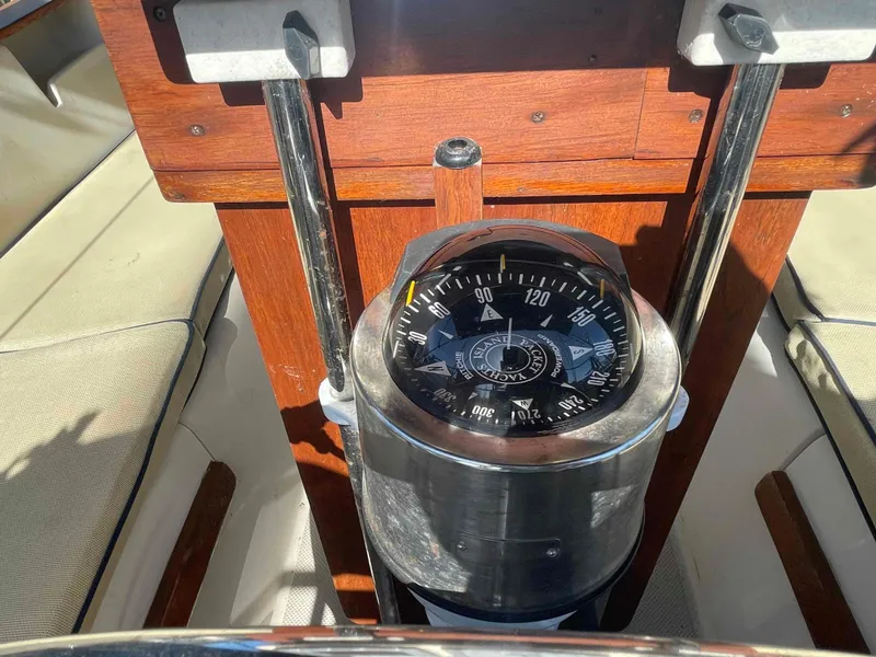 Slide: The Image of Engine compartment of a 1990 Island Packet 35 Cutter sailboat, showing detailed mechanical components. - 40