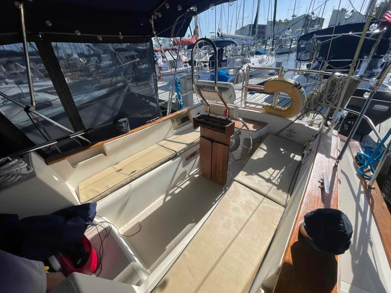 Slide: The Image of 1990 Island Packet 35 Cutter sailboat docked in a marina. - 55