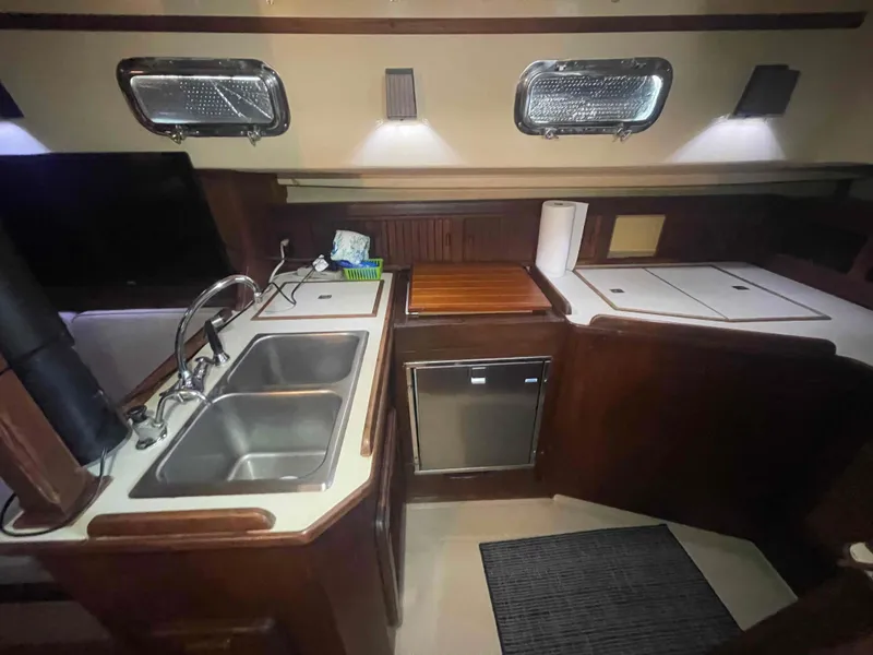 Slide: The Image of 1990 Island Packet 35 Cutter sailboat deck and railing detail. - 61