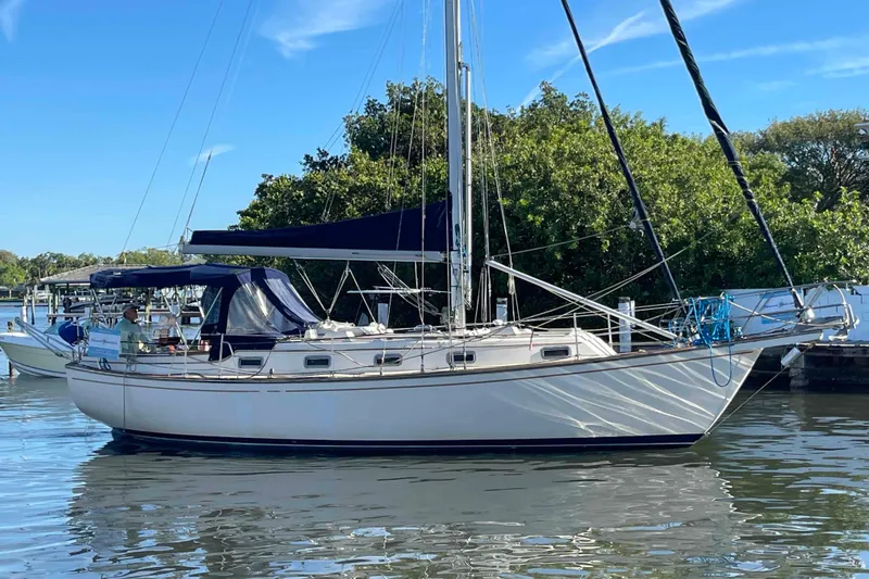 Slide: The Image of Mast and rigging of a 1990 Island Packet 35 Cutter sailboat against a clear blue sky. - 64