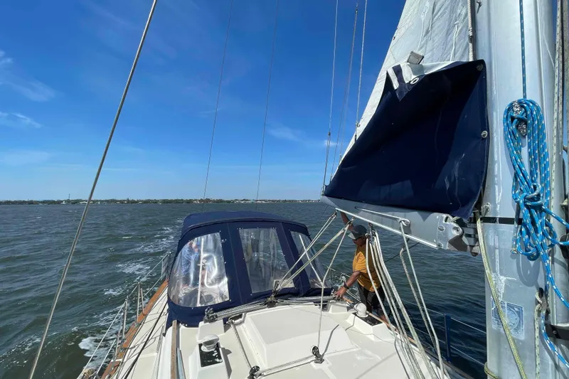 Slide: The Image of 1990 Island Packet 35 Cutter sailboat docked at marina. - 66