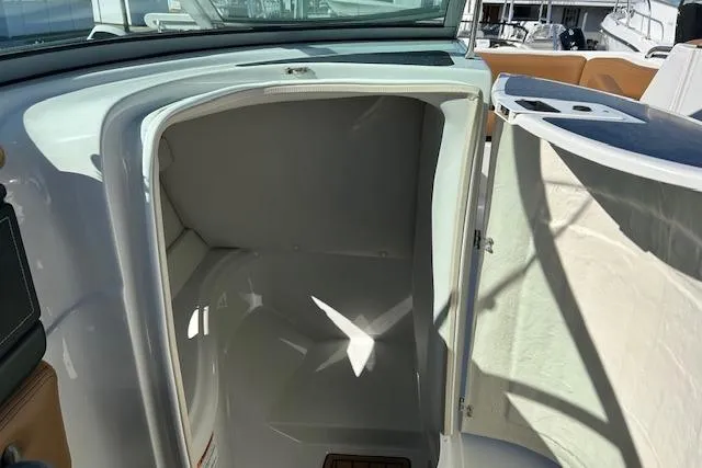 Slide: The Image of 2023 Crownline Eclipse E235 XS boat interior storage compartment. - 7