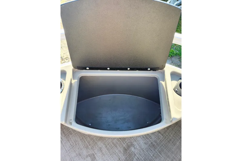 Slide: The Image of Open storage compartment on 2022 Sun Tracker Bass Buggy 16 XL Select boat. - 12