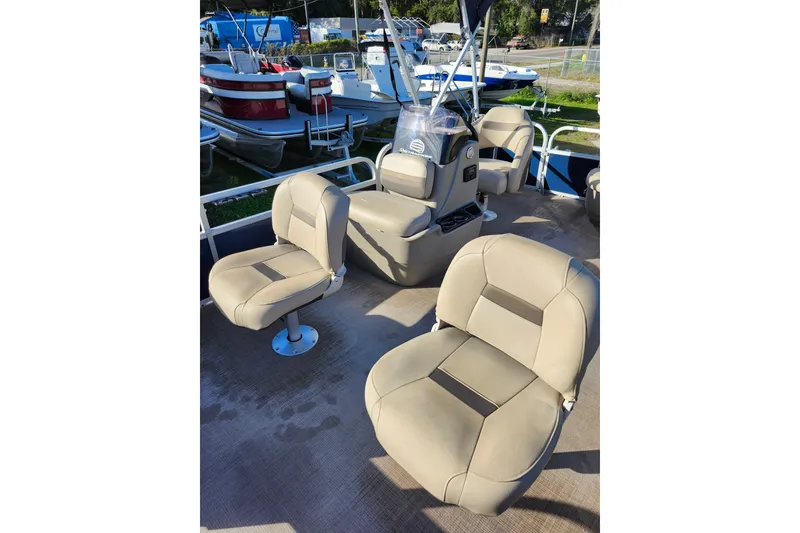 Slide: The Image of 2022 Sun Tracker Bass Buggy 16 XL Select pontoon boat interior with beige seating. - 13