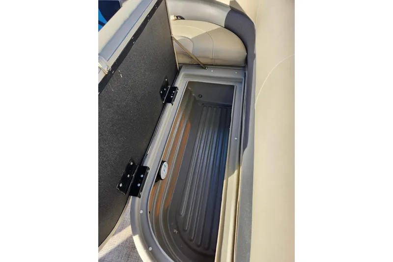 Slide: The Image of 2022 Sun Tracker Bass Buggy 16 XL Select storage compartment, open and empty. - 20