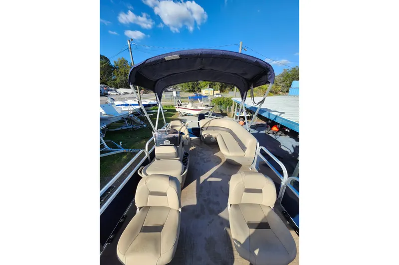 Slide: The Image of 2022 Sun Tracker Bass Buggy 16 XL Select pontoon boat with canopy and seating. - 24