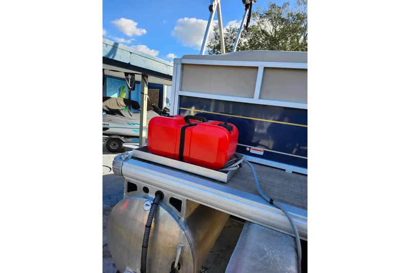 Slide: The Image of 2022 Sun Tracker Bass Buggy 16 XL Select with red fuel tank on deck. - 9