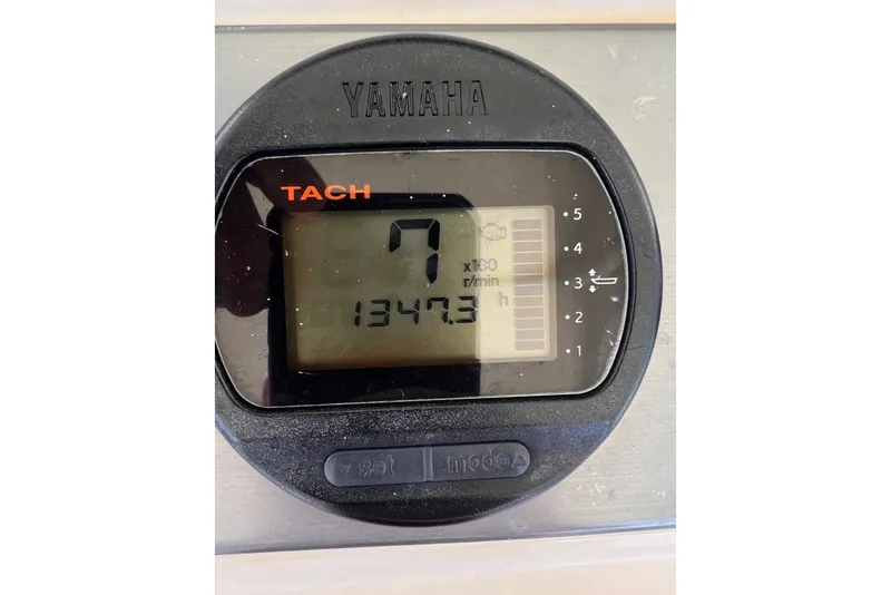 Slide: The Image of Yamaha tachometer displaying 1347.3 hours on a 2013 Scout 275 LXF boat. - 11