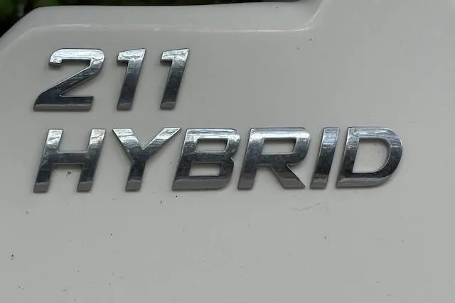 Slide: The Image of 2021 NauticStar 211 Hybrid emblem on white surface. - 16