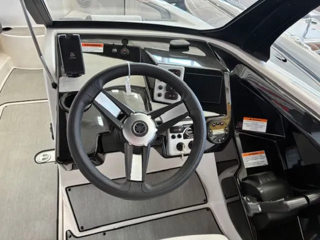 Slide: The Image of Yamaha AR220 2026 boat cockpit with modern dashboard and steering wheel. - 13