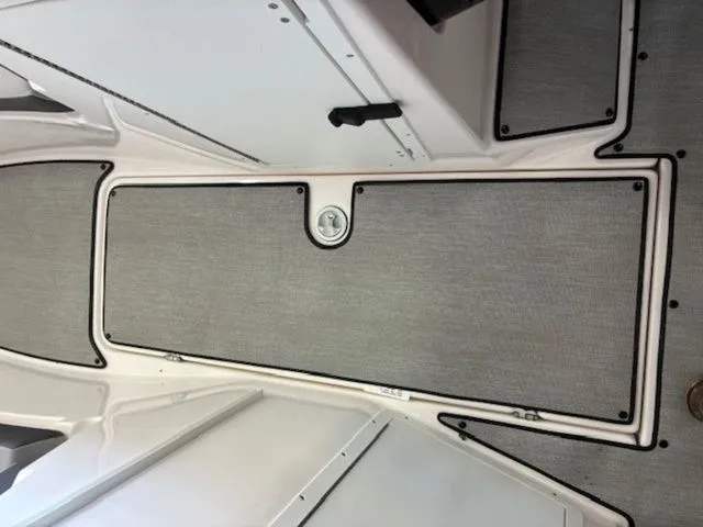Slide: The Image of Interior of Yamaha Boats AR220 2026 with gray flooring. - 16